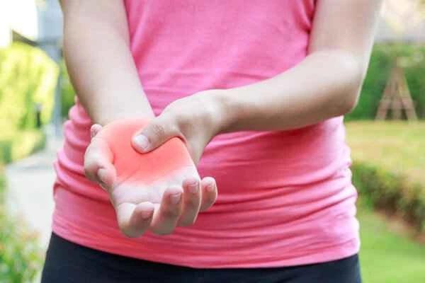 What should I do if my hand swells up after being stung by a bee?