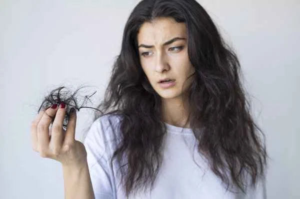 What are the main causes of hair loss in women?